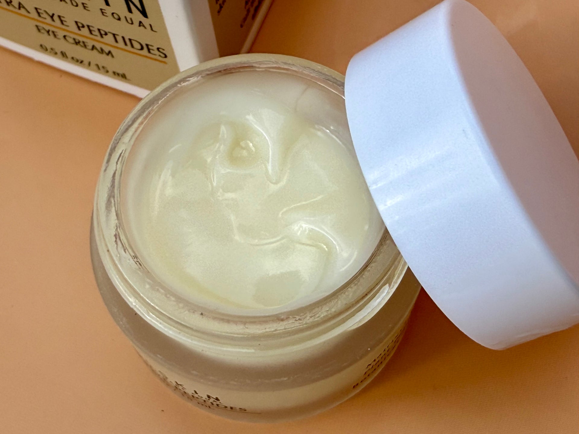 Close-up of ALLSKIN Ultra Eye Peptides eye cream showing the rich cream texture
